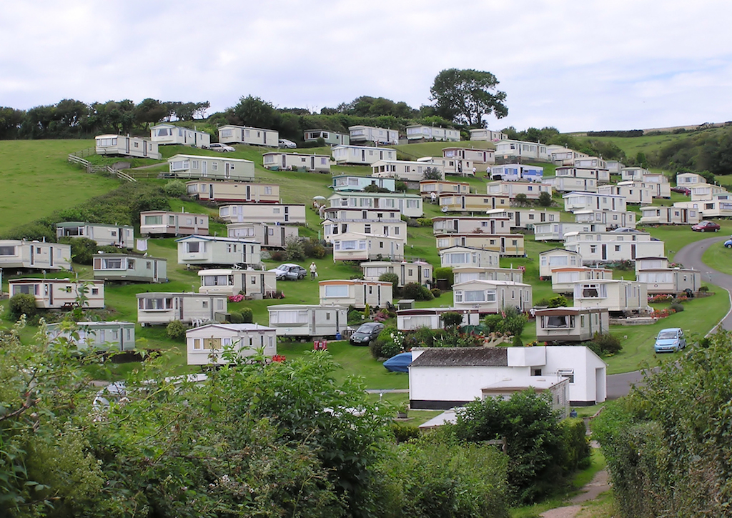 "Caravans at beer devon arp". Licensed under Public Domain via Wikimedia Commons - http://commons.wikimedia.org/wiki/File:Caravans_at_beer_devon_arp.jpg