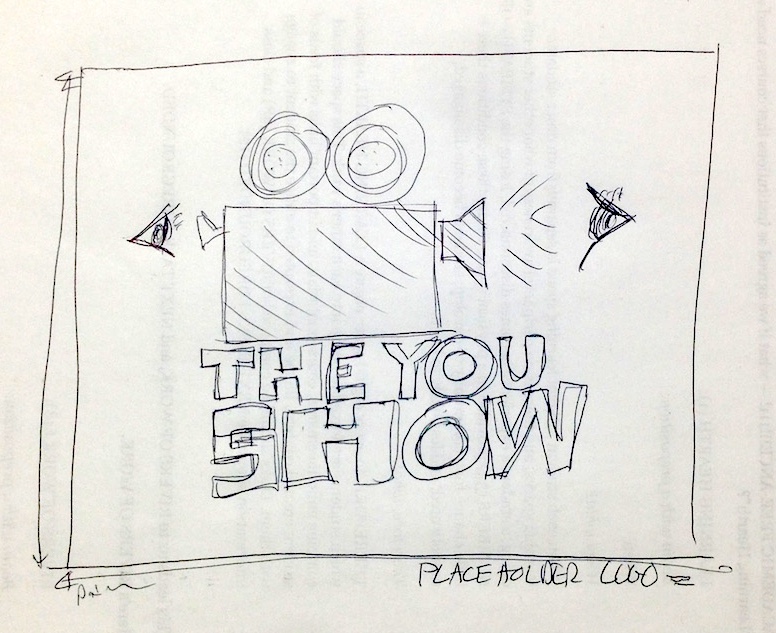 Initial You Show logo, drawn by hand on back of a  piece of printed paper.